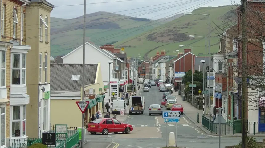 What is the geographic and economic significance of caravan parks in Towyn Wales