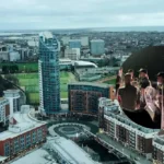Portsmouth riot police face protesters after 140 migrants rescued