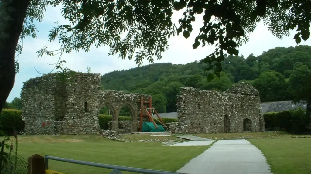 What Is the Historical and Architectural Significance of Cymer Abbey in Wales?
