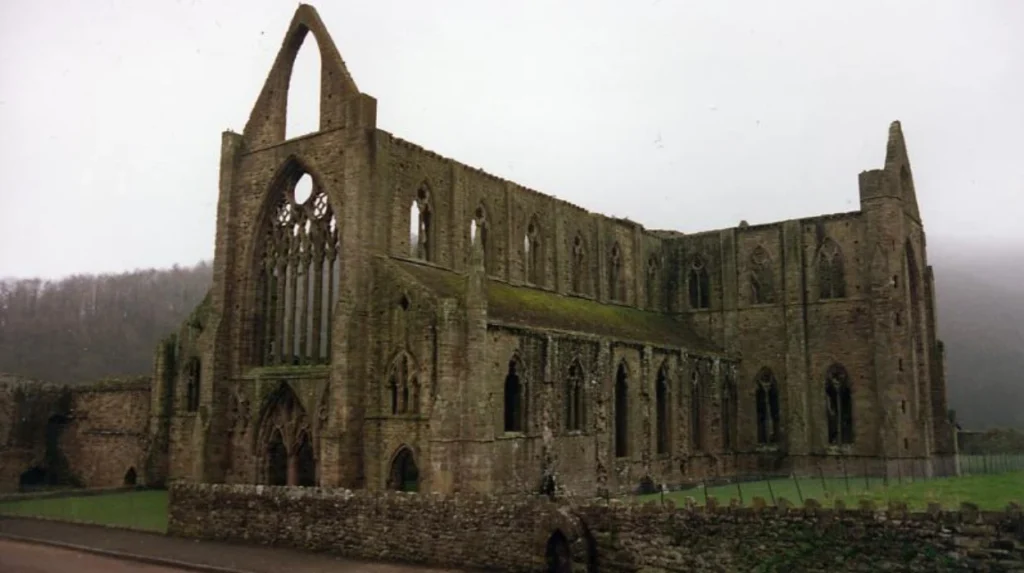 What Is the Historical and Architectural Significance of Cymer Abbey in Wales?