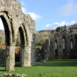 What Is the Historical and Architectural Significance of Cymer Abbey in Wales