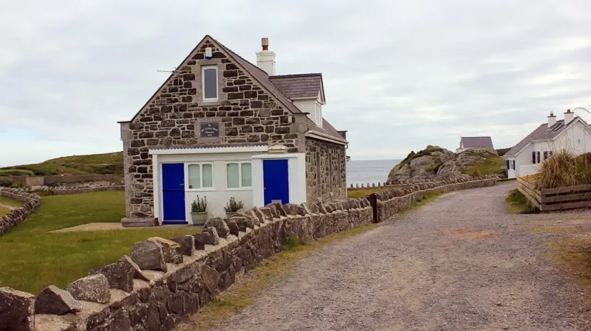 What is the geographical and historical significance of Rhoscolyn Anglesey Wales